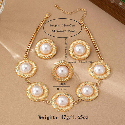 White pearl necklace flat lay on beige backdrop at Dover Grace Boutique in Watkinsville, Georgia.