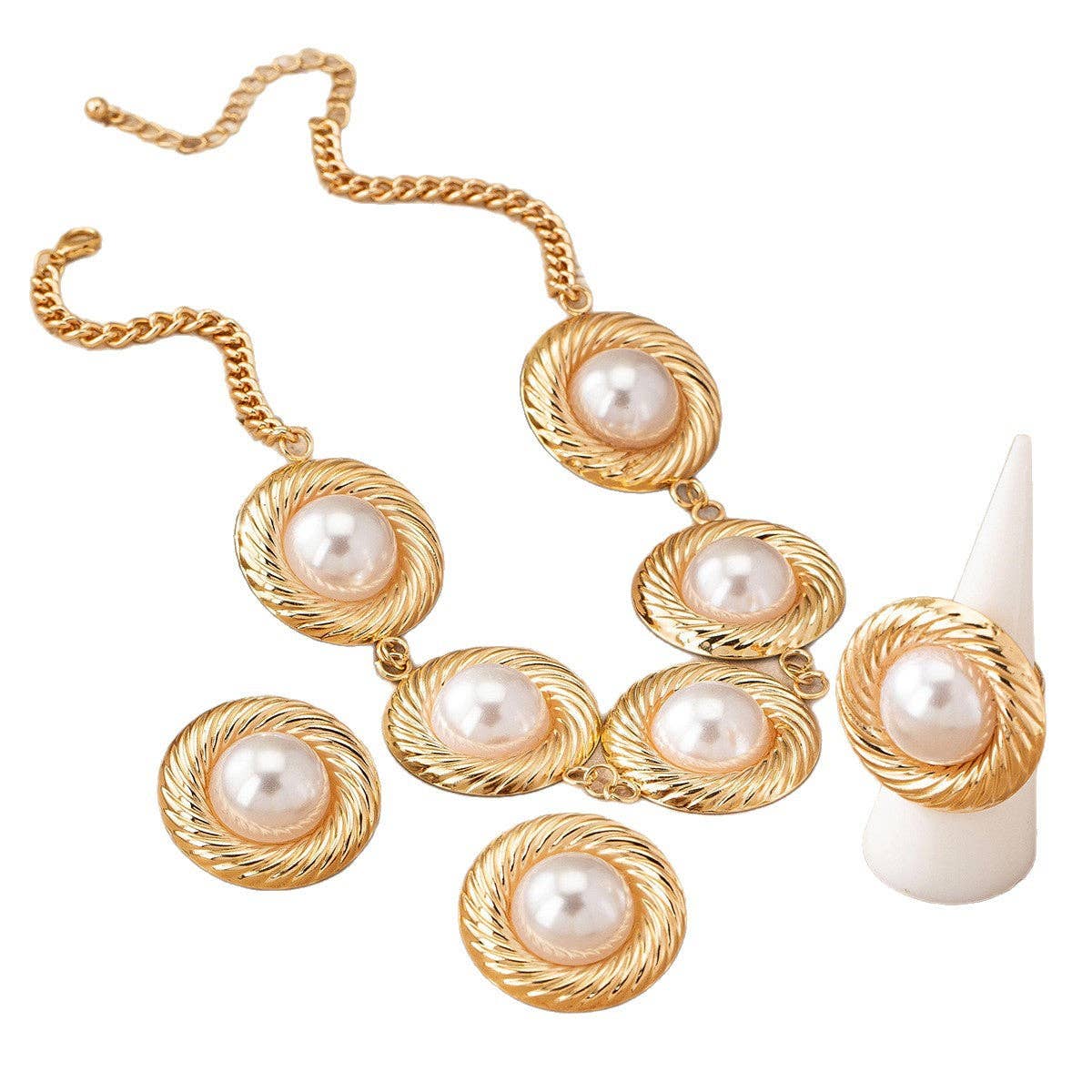White pearl gold-tone necklace on white backdrop at Dover Grace Boutique in Watkinsville, Georgia.